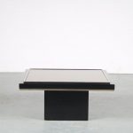 m25474 1980s black coffee table on thick black square base with small brass lining and black thick glass top small