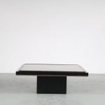 m25475 1980s black coffee table on thick black square base with small brass lining and black thick glass top big