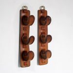 m25465 1950s Pair of wall mounted brown leather bottle holders Adnet style France