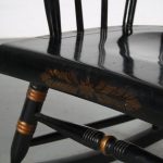 m25618 1940s Black wooden rocking chair with golden coloured details USA