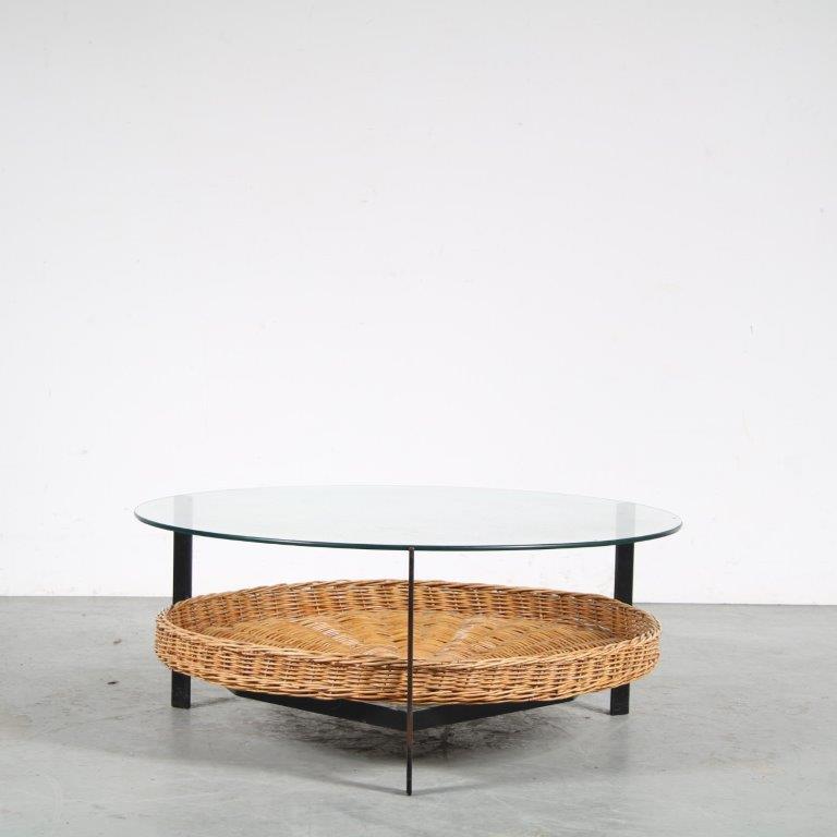 m25665 1960s Round coffee table on black metal base with wicker magazine shelf and glass top Netherlands