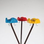 m25731 1960s Free standing coat rack on brown metal base with three multi coloured plastic hooks Enzo Mari Danese, Italy
