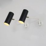 L4847 1950s Pair of cylinder shaped black metal wall lamps / spots with white arms Raak, Netherlands
