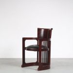 m26156 1980s "Barrel" chair in dark wood with black leather upholstery Frank lloyd Wright Italy