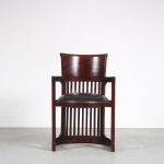 m26156 1980s "Barrel" chair in dark wood with black leather upholstery Frank lloyd Wright Italy