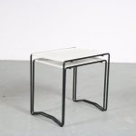 m26136 1960s Pair of nesting tables on black metal base with white metal perforated tops Artimeta, Netherlands