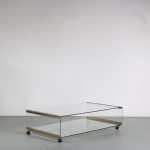 m26079 1970s Large double layered coffee table on wheels in glass with brass Pierangelo Gallotti Gallotti & Radice, Italy