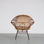 m26300 1950s Nice styled rattan easy chair on black metal base Rohé, Netherlands