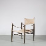 m26453 1960s Safari chair on wooden base with canvas upholstery and leather arm strings Farstrup, Denmark