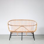 m26585 1950s 2-Seater sofa on black metal base with rattan shell by Rohé, Netherlands