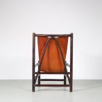INC142 1970s Sling chair, dark wooden base, thick leather seat Netherlands Gerard