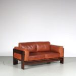 m27066 1970s 2-Seater sofa with rosewooden frame and cognac leather cushions, model Bastiano Tobio Scarpa Gavina, Italy