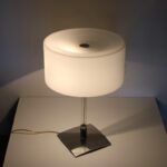 L5183 2000s Table lamp on chrome with glass base with milk glass hood, model Drum Fontana Arte, Italy