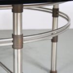 m27554 1980s Round coffee table on metal with brass base and smoked glass top, Germany