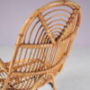 m27678 1950s Rattan easy chair on black metal base / Gebroeders Jonkers, Netherlands