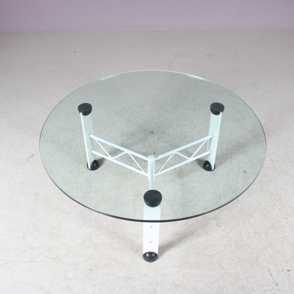 m27654 1980s Coffee table on white metal base with round glass top / Germany