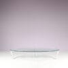 m27846 1980s Oval coffee table with stainless steel base and thick glass top Netherlands