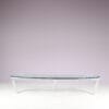 m27846 1980s Oval coffee table with stainless steel base and thick glass top Netherlands