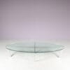 m27846 1980s Oval coffee table with stainless steel base and thick glass top Netherlands