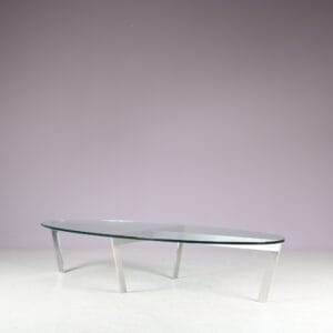 m27846 1980s Oval coffee table with stainless steel base and thick glass top Netherlands