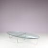 m27846 1980s Oval coffee table with stainless steel base and thick glass top Netherlands