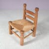 m27886 1950s Low fire side chair in oak wood with rush seat attributed to Charles Dudouyt, France