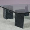 m27894 1980s Coffee table with four marble feet and glass top in the style of Vignelli (Metafora) / Italy