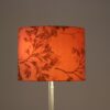 L5487 1960s Floor lamp on chrome plated metal base with black foot and red fabric shade Netherlands