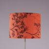 L5487 1960s Floor lamp on chrome plated metal base with black foot and red fabric shade Netherlands