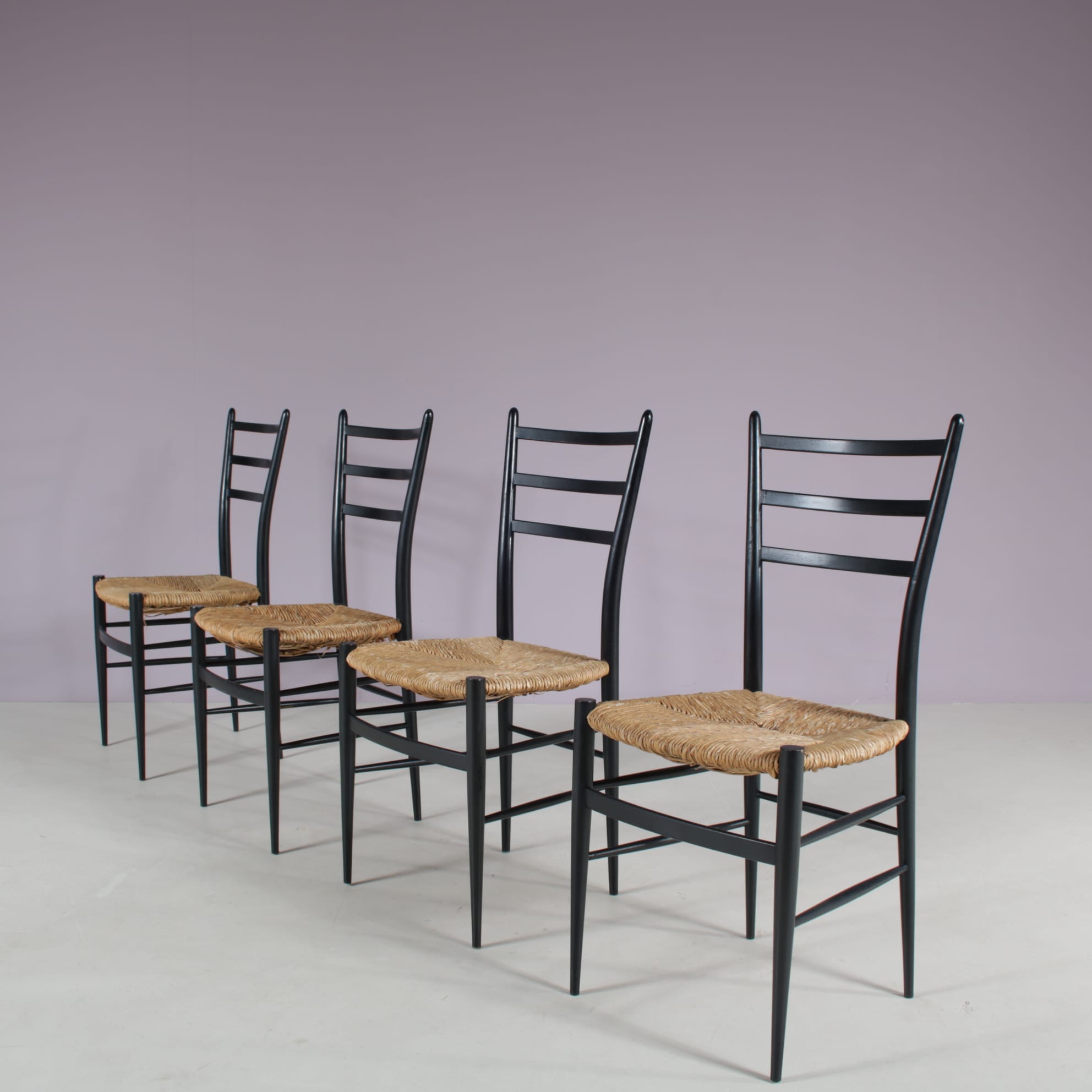 m28108 1950s Set of 4 Spinetto dining chairs in black wood with rush Chiavari, Italy