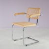 m28165 1970s Cesca chair with armrests on chrome plated metal base with webbing upholstery Italy
