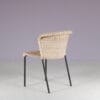 m28077 1950s Set of 4 dining chairs on black metal base with wicker upholstery, Netherlands
