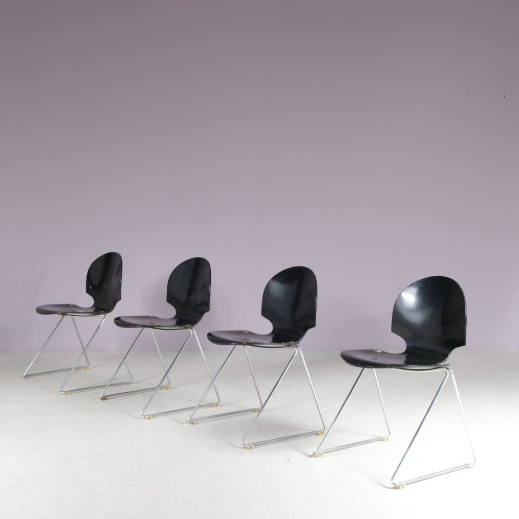m28224 1980s Set of four stacking chairs in chrome metal with black wood Lawrence Minsker Fritz Hansen, Denmark