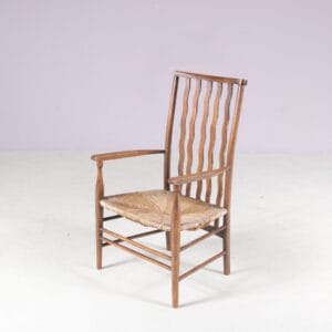 1930s small low spindlers back hearth chair / side chair with wicker seat Arts & Craft Movement Morris & Co for Liberty and Co Stowaway London