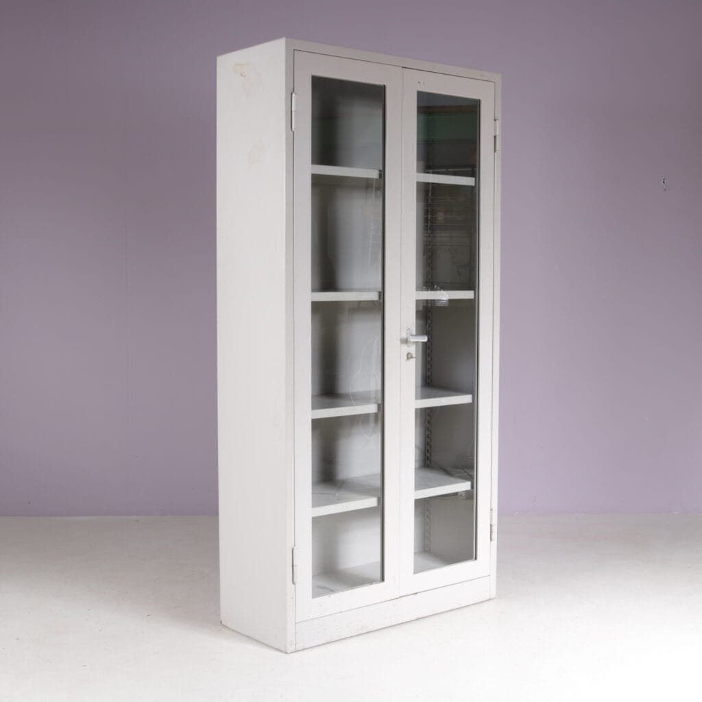 1960s Industrial bookcase gray metal with glass in the doors