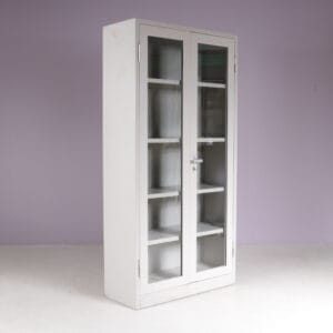 1960s Industrial bookcase gray metal with glass in the doors